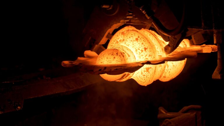 Close up of red hot steel detail at the steel plant, heavy metallurgy concept. Scene. The process of